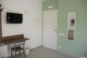 TV a/nebo společenská místnost v ubytování B&B Il Melograno