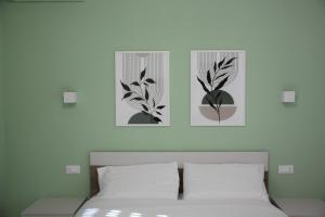 Postel nebo postele na pokoji v ubytování B&B Il Melograno