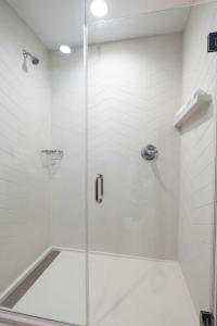 a shower with a glass door in a bathroom at Fairfield Inn & Suites Arkadelphia in Arkadelphia