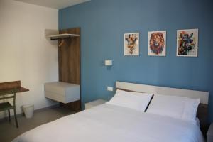 Postel nebo postele na pokoji v ubytování B&B Il Melograno