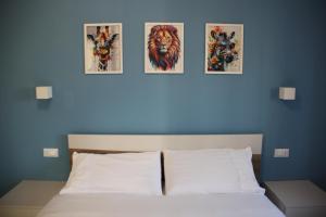 Postel nebo postele na pokoji v ubytování B&B Il Melograno