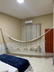 En eller flere senge i et værelse på Pousada Shalom