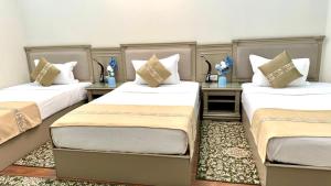 Postel nebo postele na pokoji v ubytování Khujand Deluxe Hotel