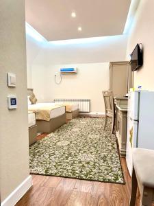 Postel nebo postele na pokoji v ubytování Khujand Deluxe Hotel