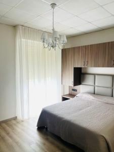 Postel nebo postele na pokoji v ubytování Cà Masawalsa Hotel