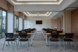 a conference room with tables and chairs in it at Four Points by Sheraton Nairobi Airport in Nairobi +19 photos