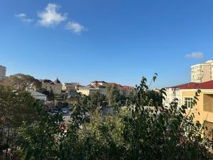 a view of a city with buildings and trees at Apartment villa in Baku
