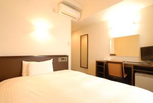 Postel nebo postele na pokoji v ubytování AB Hotel Okazaki