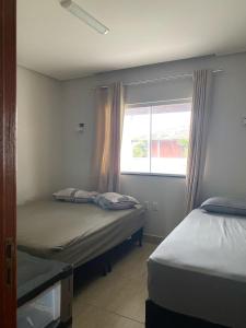 Postel nebo postele na pokoji v ubytování Casa de praia