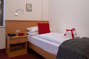 Rúm í herbergi á GH Hotel Piaz