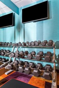 a gym with a rack full of chocolate bars at Sleep Inn & Suites Pensacola - University Area in Pensacola