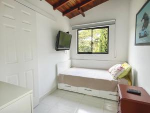 TV a/nebo společenská místnost v ubytování Las Estrellas Agrohotel