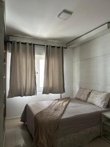 Ένα ή περισσότερα κρεβάτια σε δωμάτιο στο Coração de Capão