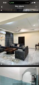 a living room with a couch and a table at B4 Rentals in Accra