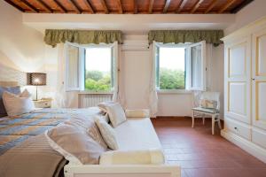 Postel nebo postele na pokoji v ubytování Cascina De' Fagiolari + 37 fotografií