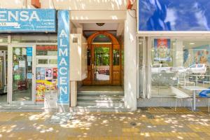 a store front with a sign in front of it at Modern apartment in front of Plaza Independencia in Mendoza