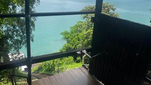 a view of the ocean from a building at Sol Victoria Marina flat 804 PC imoveis in Salvador