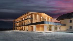 布鲁尼科A-Lunis的一座建筑前面设有游泳池