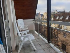 En balkon eller terrasse på Sur les toits du centre