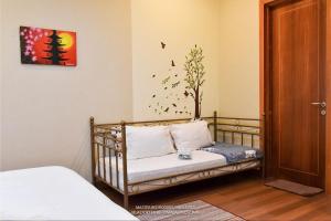 Postel nebo postele na pokoji v ubytování Vimala Hills Villa & Resort + 37 fotografií