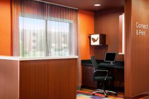 an office with a desk and a chair and a window at Fairfield Inn & Suites Lansing West in Delta Center Township +5 photos