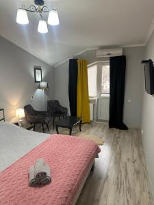 Postel nebo postele na pokoji v ubytování Ștefan House 1