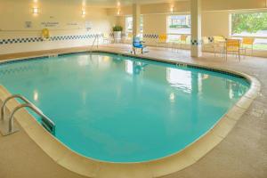 a large pool with blue water in a hospital at Fairfield Inn Joplin in Joplin