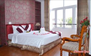 Postel nebo postele na pokoji v ubytování Pho Nui Hotel