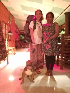 two women standing next to a dog in a room at Greenbury Kite Hostel & Restaurant in Kalpitiya +30 photos