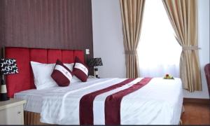 Postel nebo postele na pokoji v ubytování Pho Nui Hotel