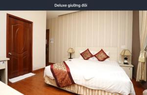 Postel nebo postele na pokoji v ubytování Pho Nui Hotel