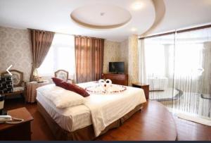 Postel nebo postele na pokoji v ubytování Pho Nui Hotel