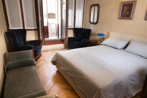 Postel nebo postele na pokoji v ubytování B&B al Torrione Belluno