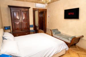 Postel nebo postele na pokoji v ubytování B&B al Torrione Belluno