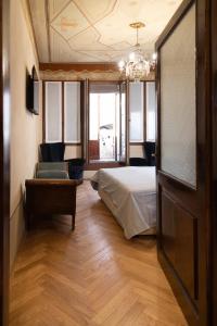 Postel nebo postele na pokoji v ubytování B&B al Torrione Belluno