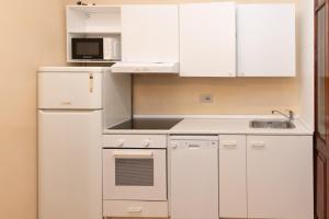 Kuchyň nebo kuchyňský kout v ubytování B&B al Torrione Belluno