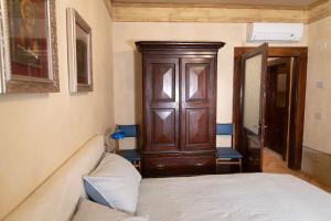 Postel nebo postele na pokoji v ubytování B&B al Torrione Belluno