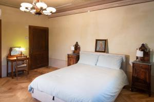 Postel nebo postele na pokoji v ubytování B&B al Torrione Belluno