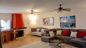 a living room with a couch and a table at Villa Tranquilla in Estepona