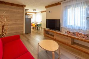 TV a/nebo společenská místnost v ubytování Relais Du Foyer