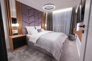 Postel nebo postele na pokoji v ubytování Jacuzzi & Sauna Skyview