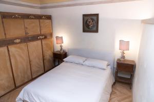 Postel nebo postele na pokoji v ubytování B&B al Torrione Belluno