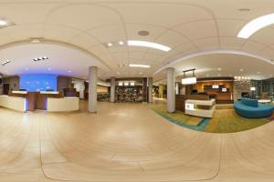 an empty lobby of a hospital with a large room with aocrates at Fairfield Inn & Suites by Marriott Phoenix Tempe/Airport in Tempe +11 photos
