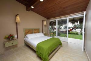 Ένα ή περισσότερα κρεβάτια σε δωμάτιο στο Hotel Kundalini
