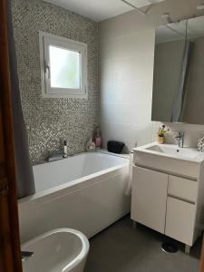 a white bathroom with a tub and a sink at AZAHAR in Lecrin +18 photos