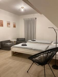 Postel nebo postele na pokoji v ubytování Apartmán Krkonoše Rokytnice