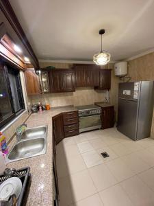 Kuchyň nebo kuchyňský kout v ubytování Toum's Apartments + 8 fotografií