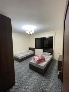 Postel nebo postele na pokoji v ubytování Toum's Apartments