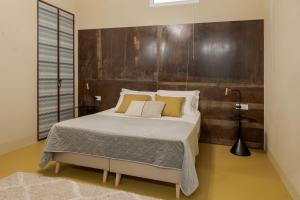 Postel nebo postele na pokoji v ubytování Villa Sardino + 11 fotografií