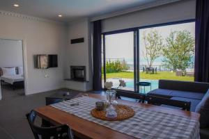 a living room with a table and a couch at SAPANCA JOWA in Sapanca